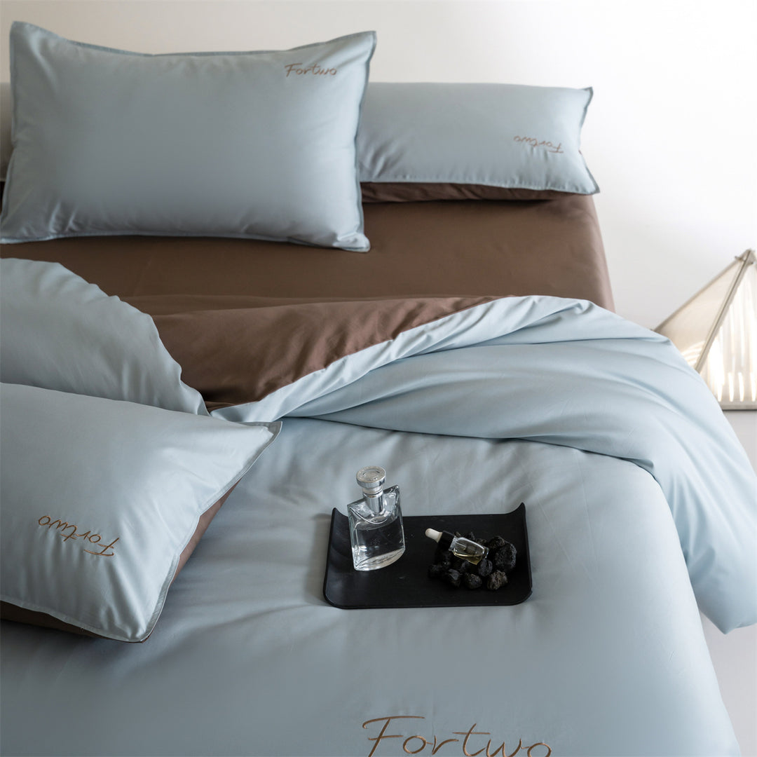 Reversible satin bedding set with fine tone-on-tone embroidery