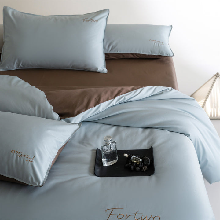 Reversible satin bedding set with fine tone-on-tone embroidery