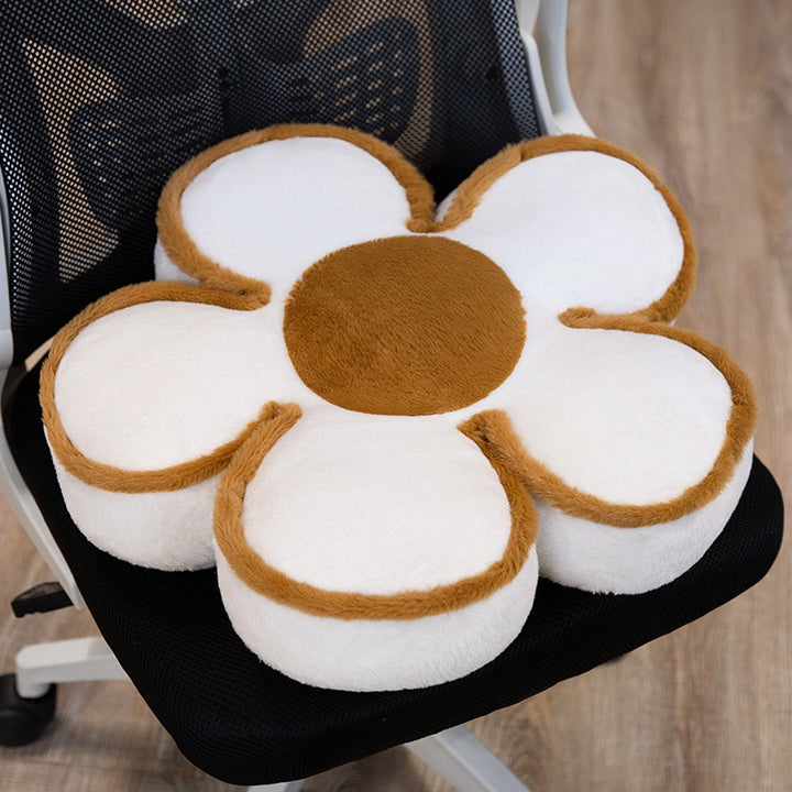 Padded seat cushion in flower shape with faux leather center piece and fluffy edge padding