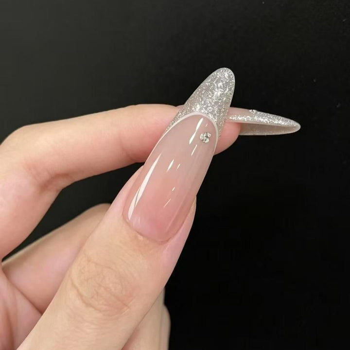 Stiletto Nail Enhancements with Glitter and Star Accents