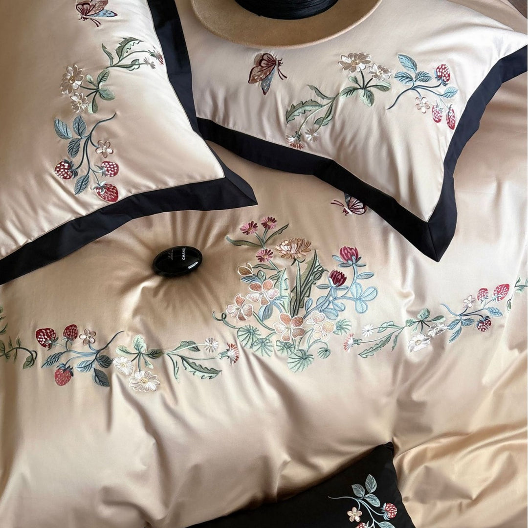 Luxurious embroidered satin bedding set with contrast piping and decorative pillow