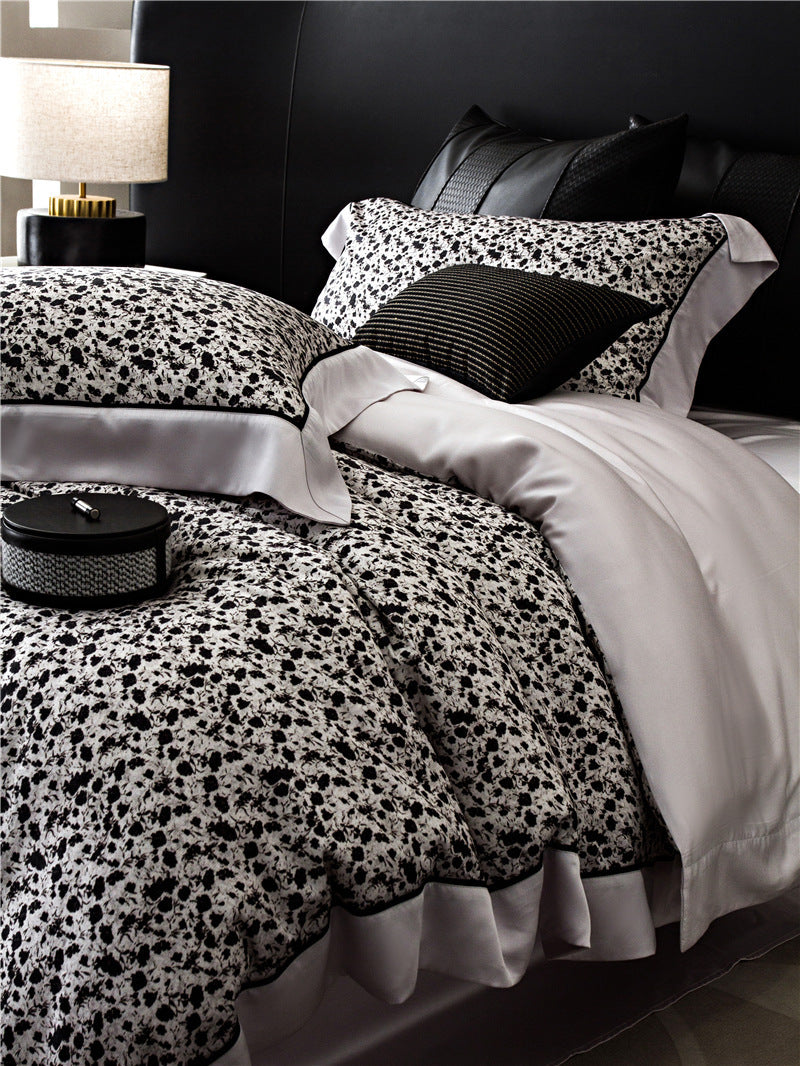 Duvet cover set made of cotton satin with subtle watercolor flower print and silky-matte texture