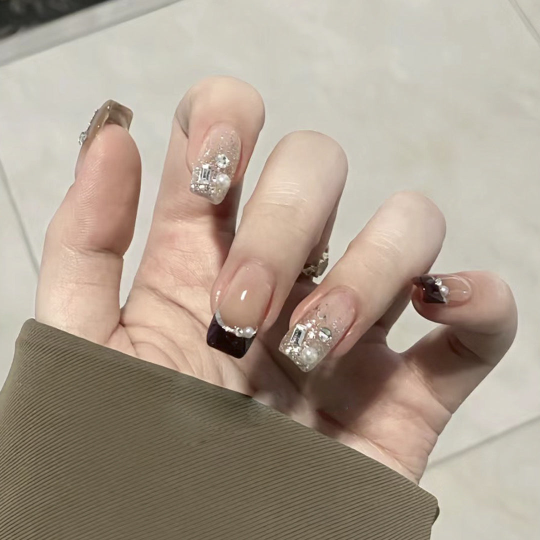 Artistic nail designs with glitter and rhinestone accents Kalsten