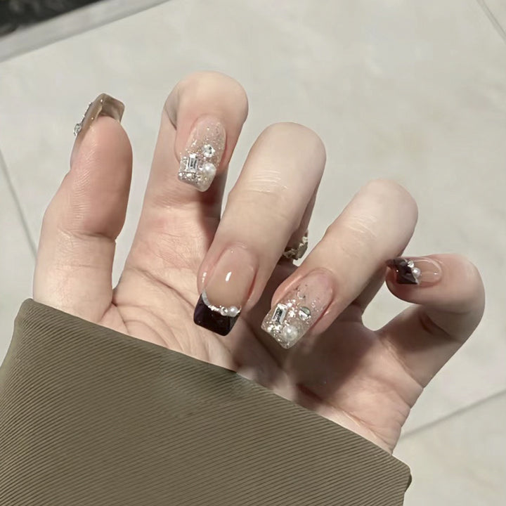 Artistic nail designs with glitter and rhinestone accents Kalsten