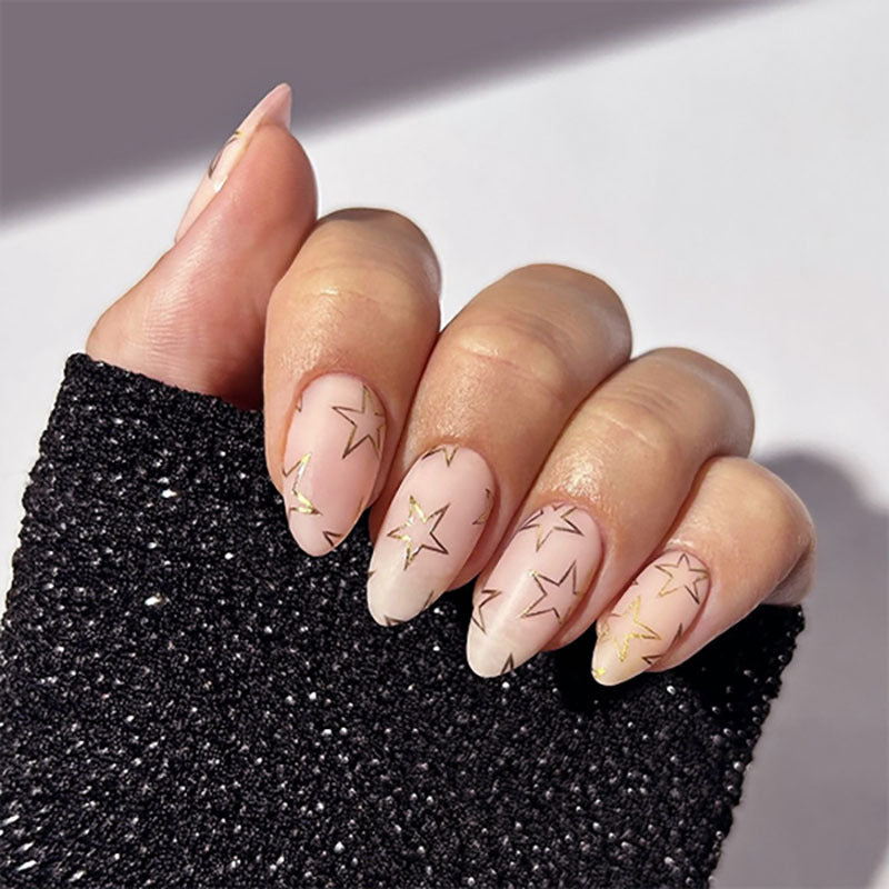Artful Nail Art with Golden Star Motifs Kalsten