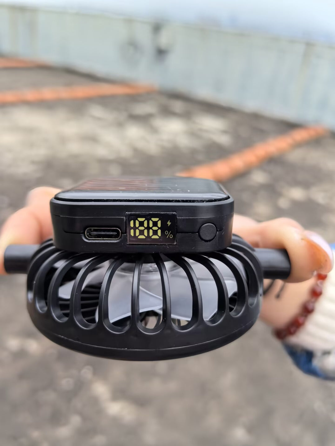 Solar-powered mini fan with digital battery level indicator and USB-C charging port Kalsten
