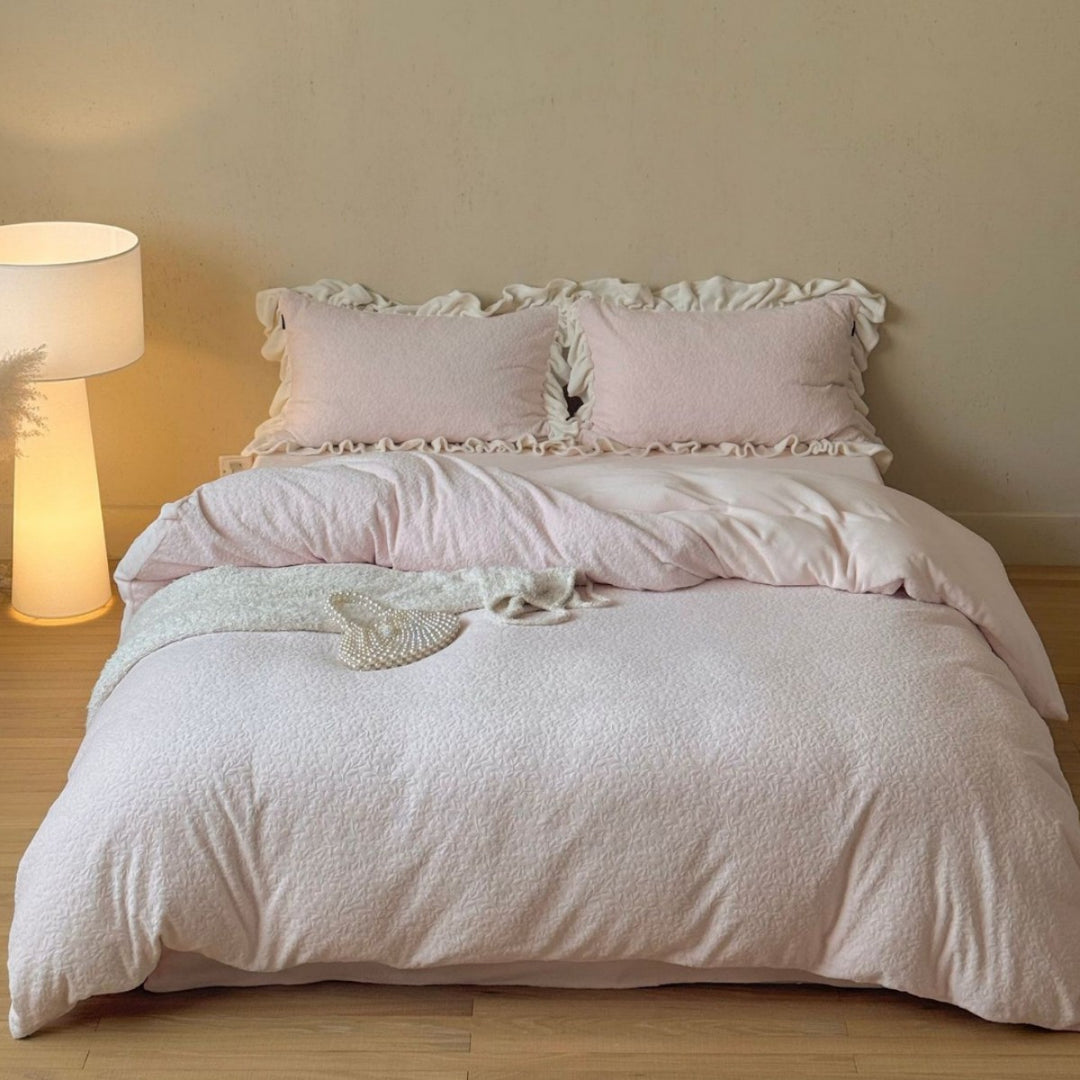 Bedding set with ruffle border and textured cotton blend