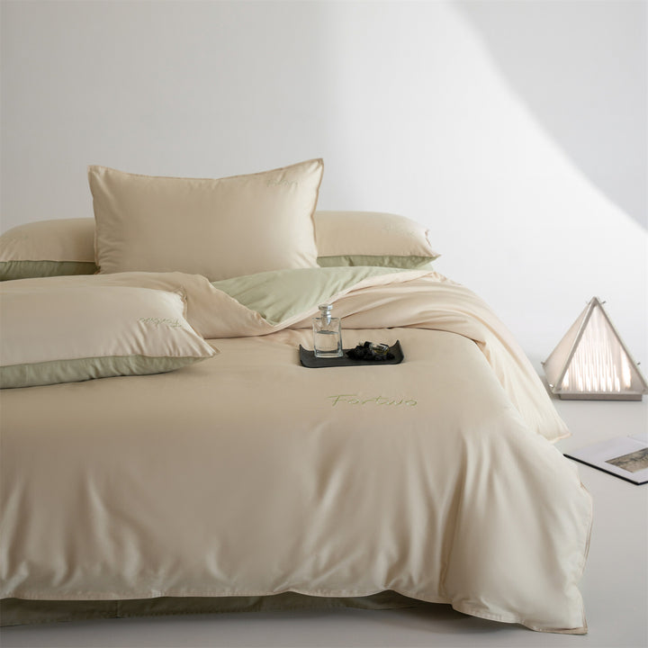 Reversible satin bedding set with fine tone-on-tone embroidery