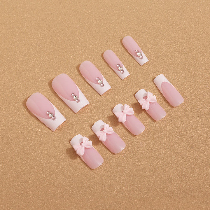 Trendy French-design artificial nails with bow accents Kalsten