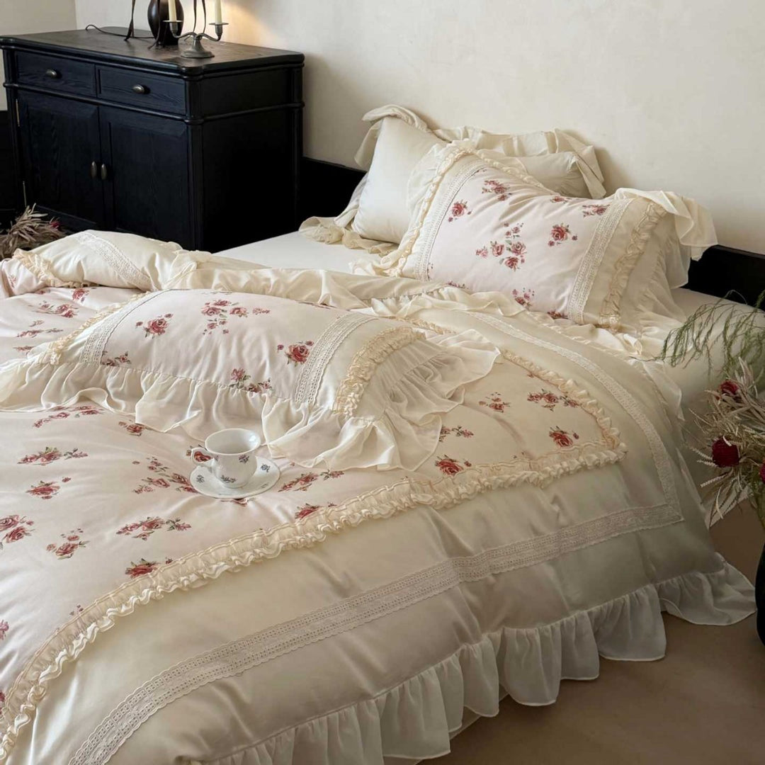 Luxury bedding set made of cotton satin with a ruffled bed skirt, lace trim, and quilted vintage blanket