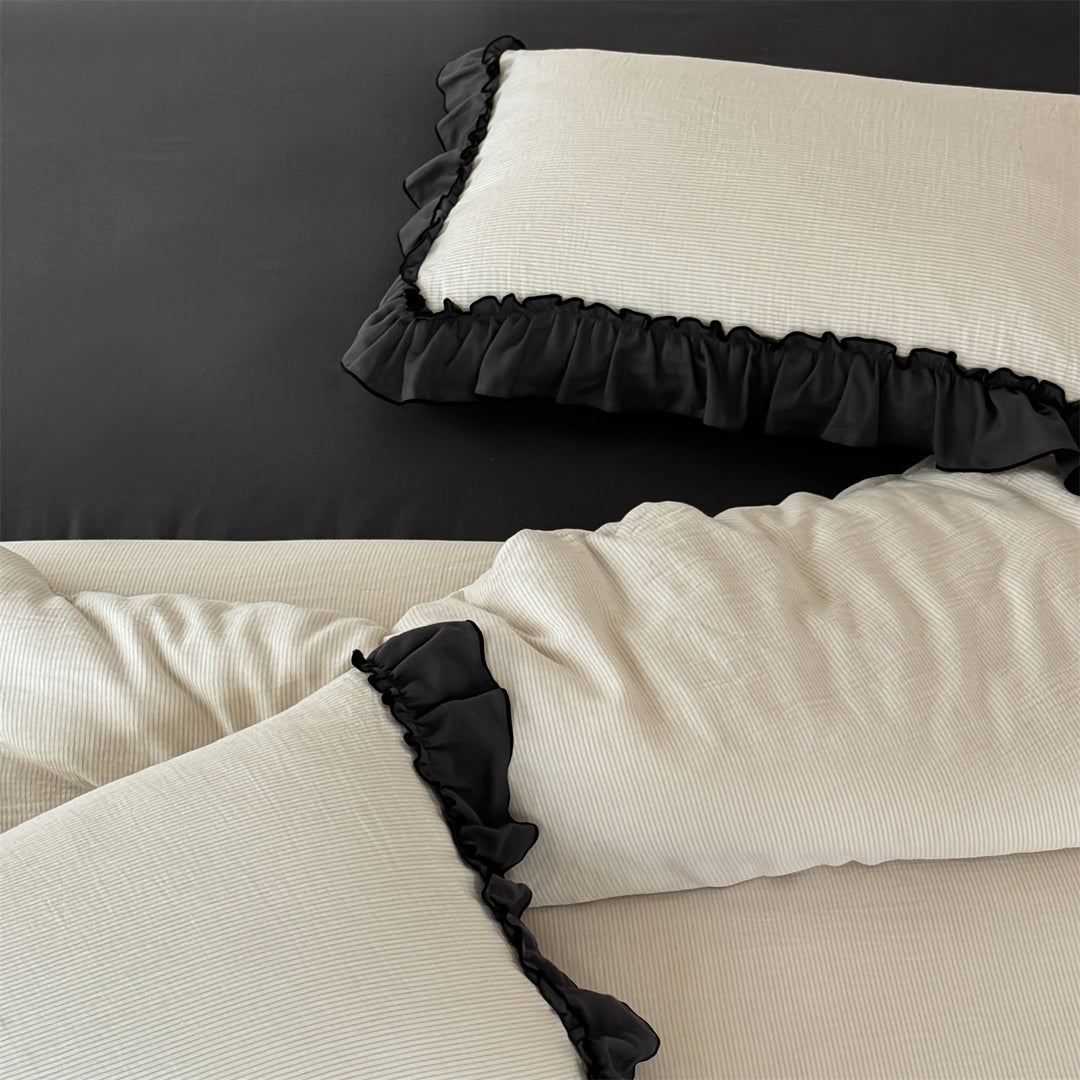 Bedding set with decorative ruffle trim and fine cotton texture