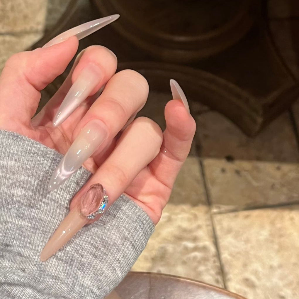 Glamorous Stiletto Nail Art Extensions with Decorative Accents