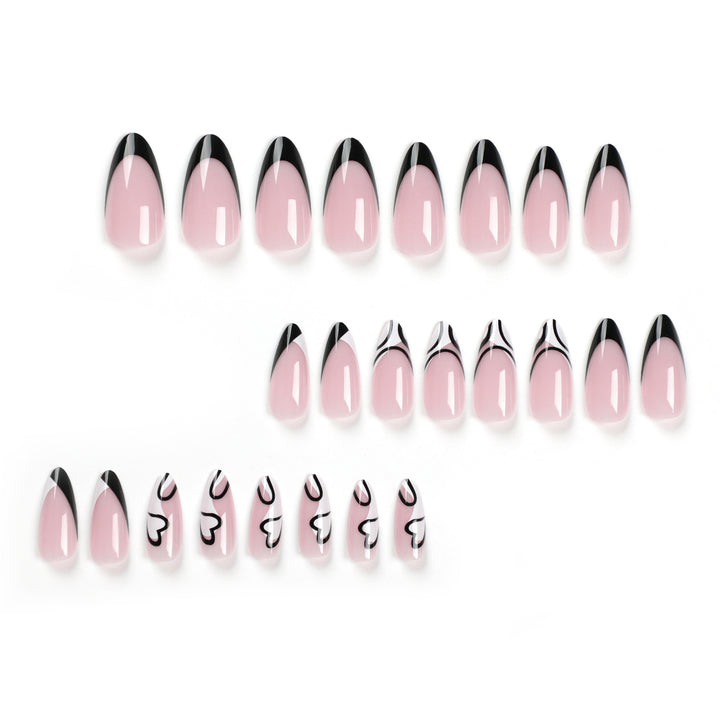 Artful stiletto nails with elegant black-and-white design Kalsten