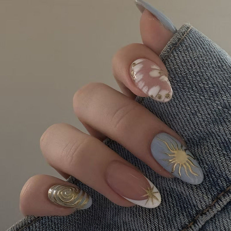 Nail art set with elegant gold accents and creative design Kalsten
