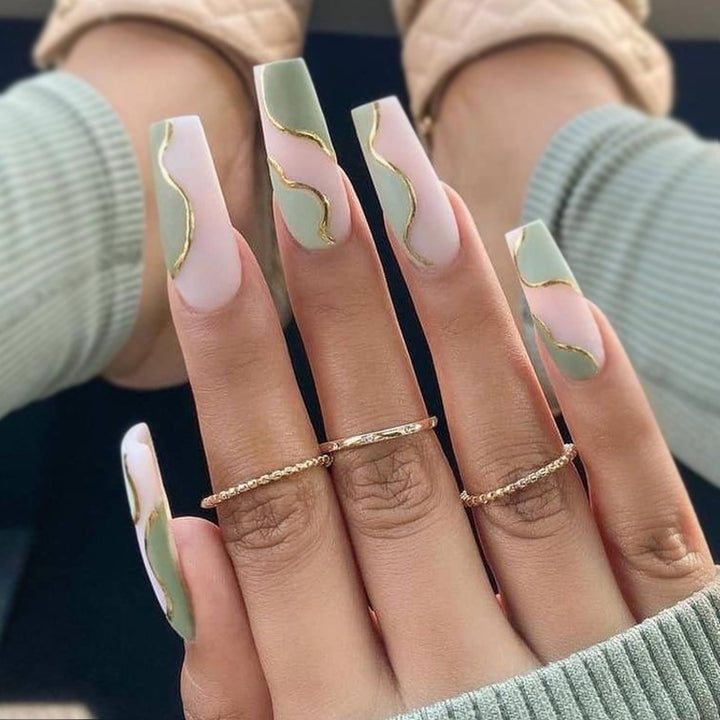 Artful Gel Nails with Elegant Wave Design and Gold Accents Kalsten