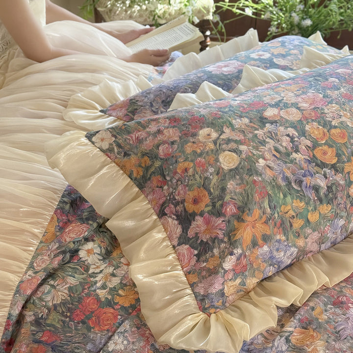 Romantic bedding set with floral center panel and pleated satin ruffle