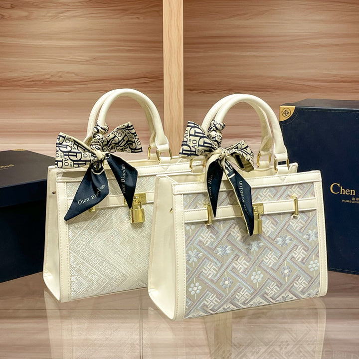 Elegant Designer Handbag with Decorative Bow