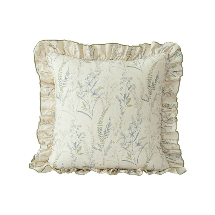 Decorative pillow with ruffles and floral linen cover