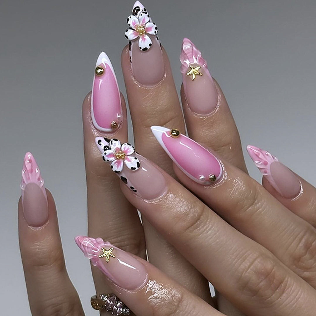 Artistic nail extensions with floral accents and glitter Kalsten