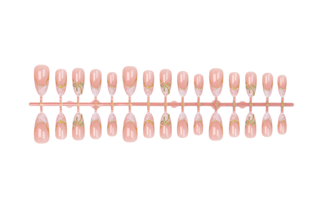 Acrylic nail set with elegant tips and delicate embellishments Kalsten