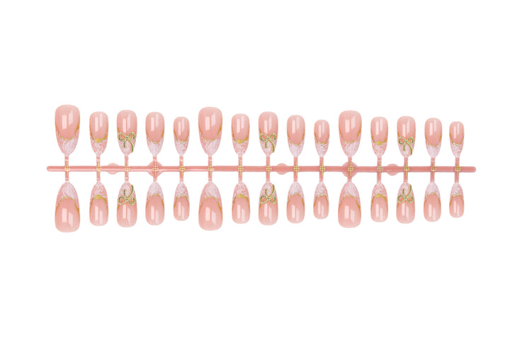 Acrylic nail set with elegant tips and delicate embellishments Kalsten
