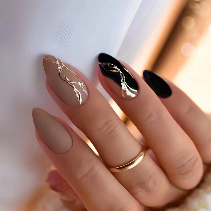 Artful nail designs with elegant gold accent Kalsten