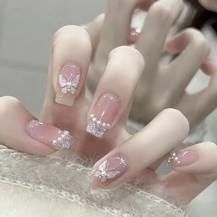 Artistic Nail Art with Glitter and Flower Applications Kalsten