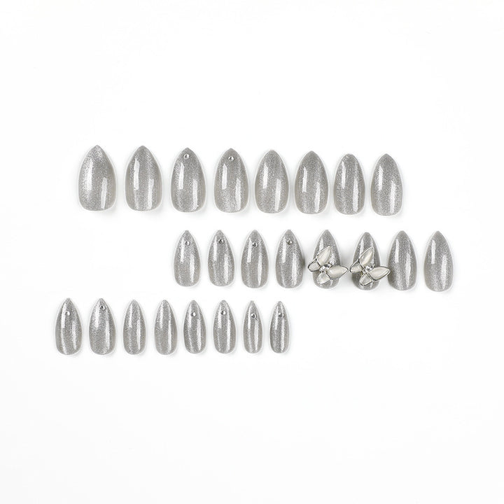 Glamorous stiletto nails with radiant glitter and elegant 3D design Kalsten