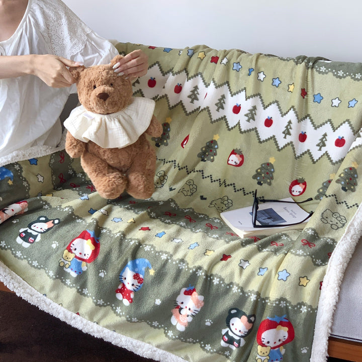 Reversible fleece blanket with cartoon cat design and teddy lining