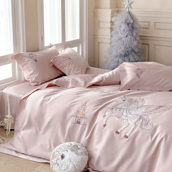 Luxurious satin bedding set with embroidered unicorn motif and fairy tale castle application