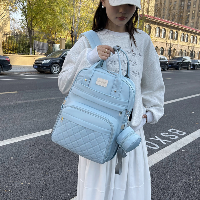 Versatile Quilted Backpack with Handy Side Pouch Kalsten