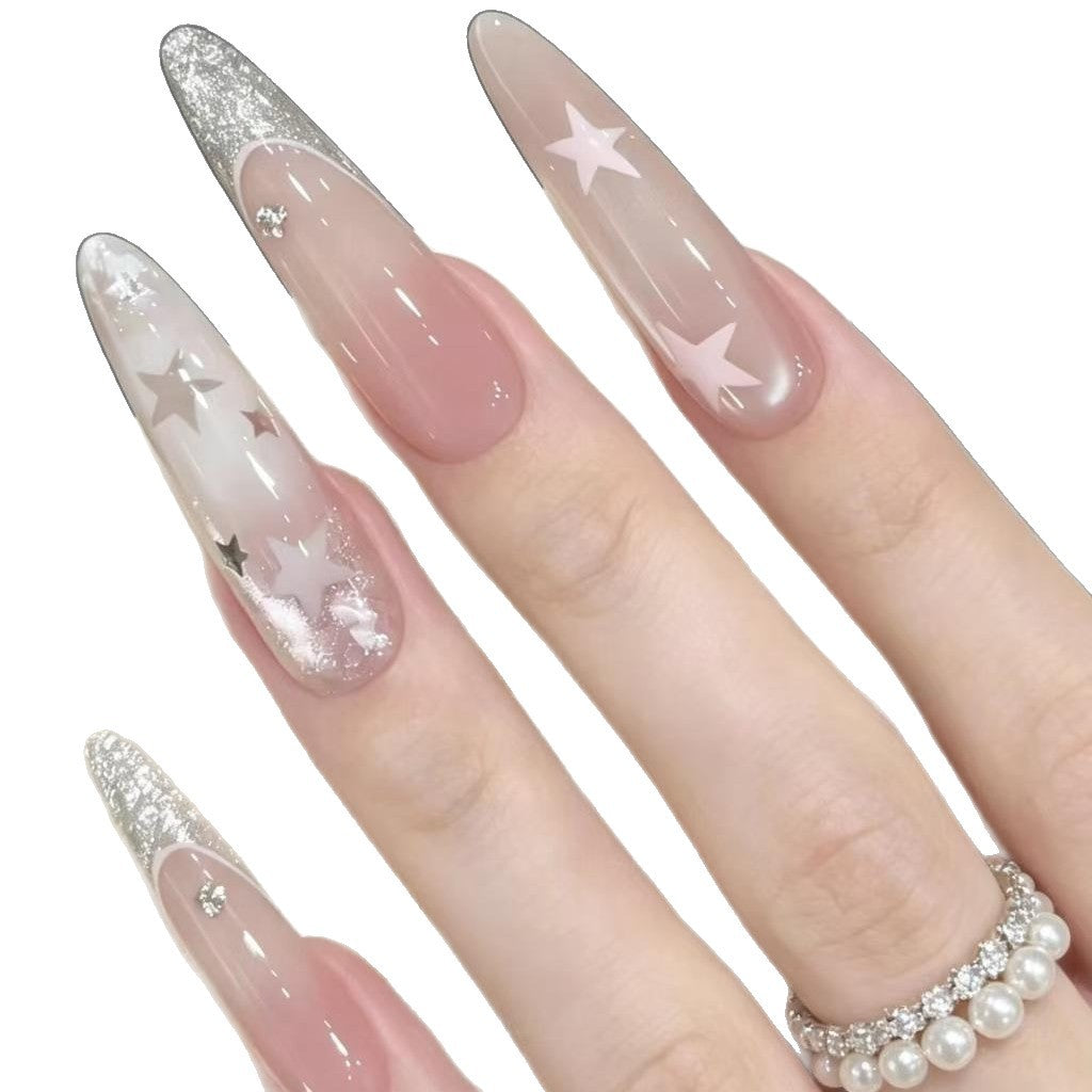 Stiletto Nail Enhancements with Glitter and Star Accents