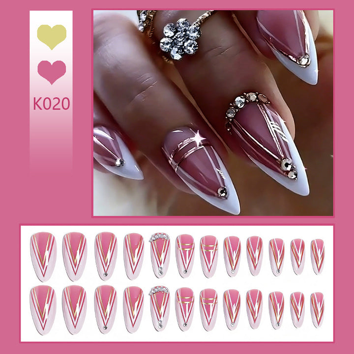Acrylic nail set with elegant stiletto shape and luxurious embellishments Kalsten