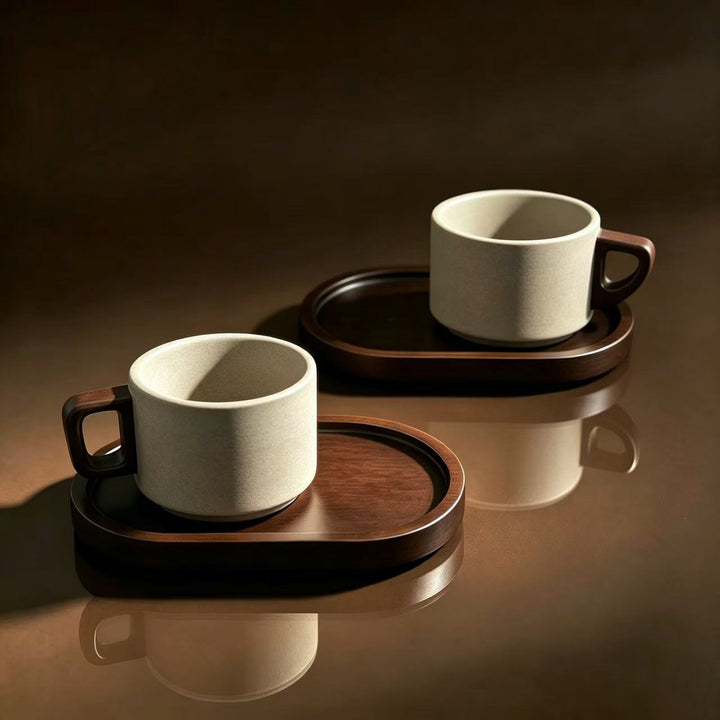 Ceramic mug with ergonomic wooden handle and matching coaster