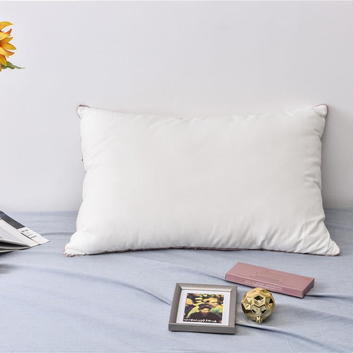 Comfort pillow with shape-stable hollow fiber filling and contrasting piping