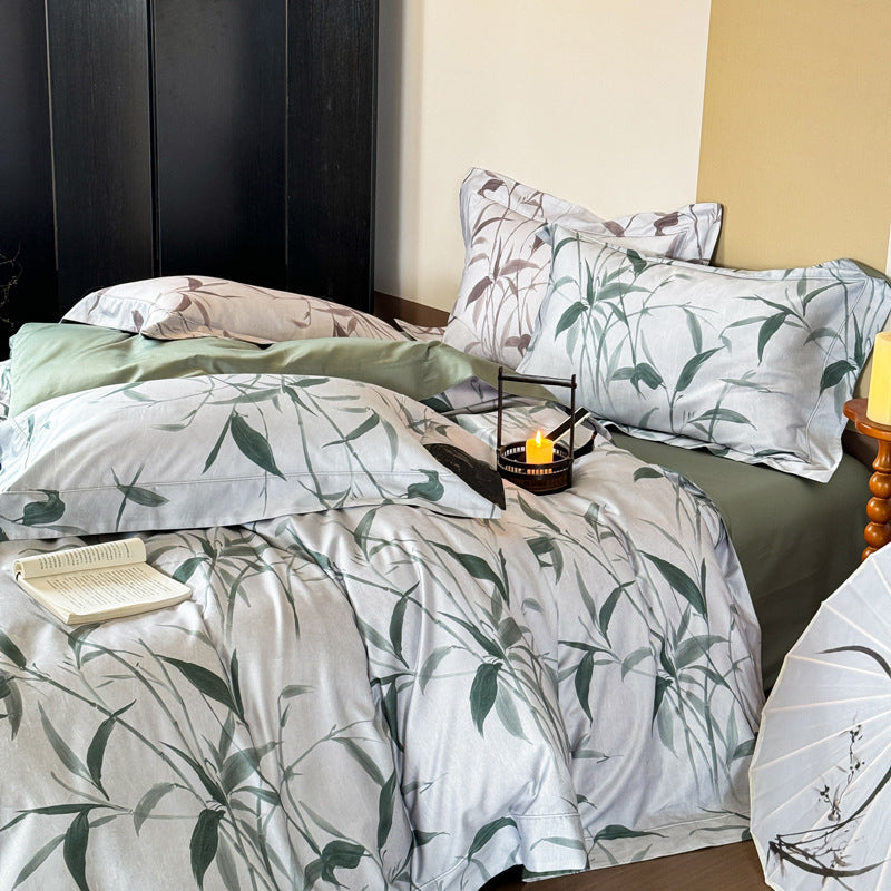 Bedding set made of cotton satin with botanical bamboo leaf print and reversible pillowcases