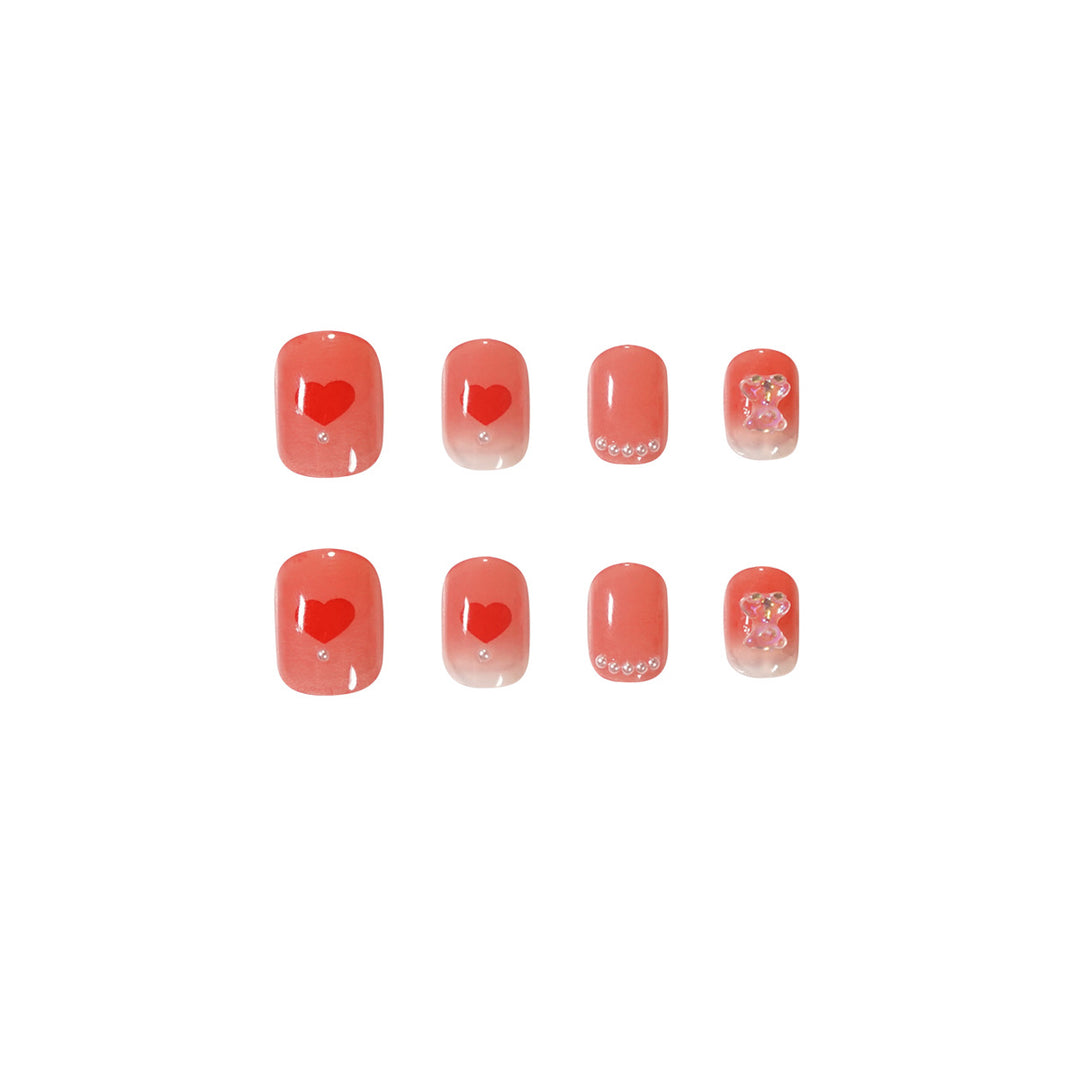 Artful nail art with radiant shine and heart motifs Kalsten