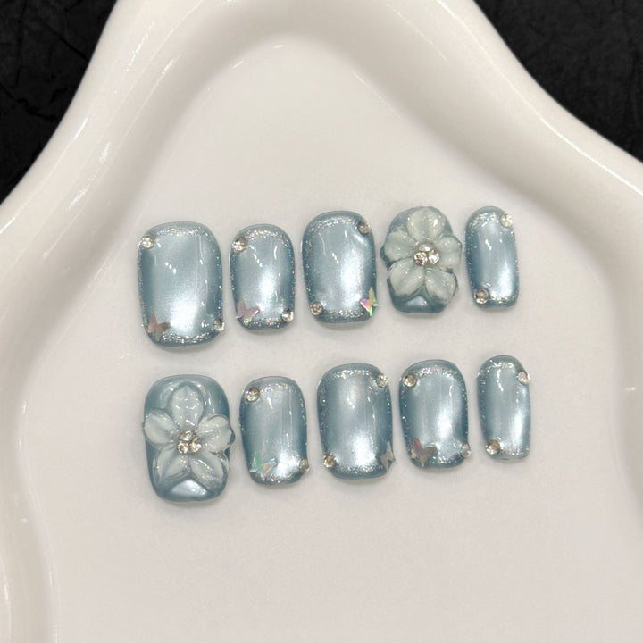 Artistic Press-On Nail Set with Floral and Rhinestone Accents