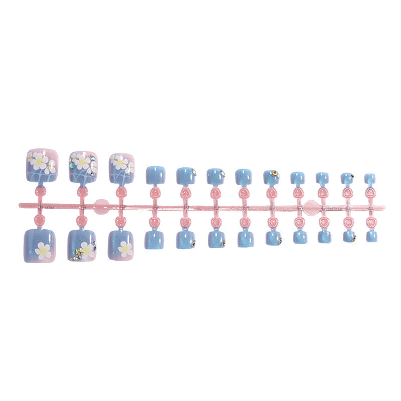 Artificial nail set with floral appliqués and glitter effects Kalsten