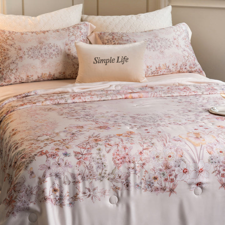Luxurious cotton satin bed linen set with delicate floral print and quilted bedspread