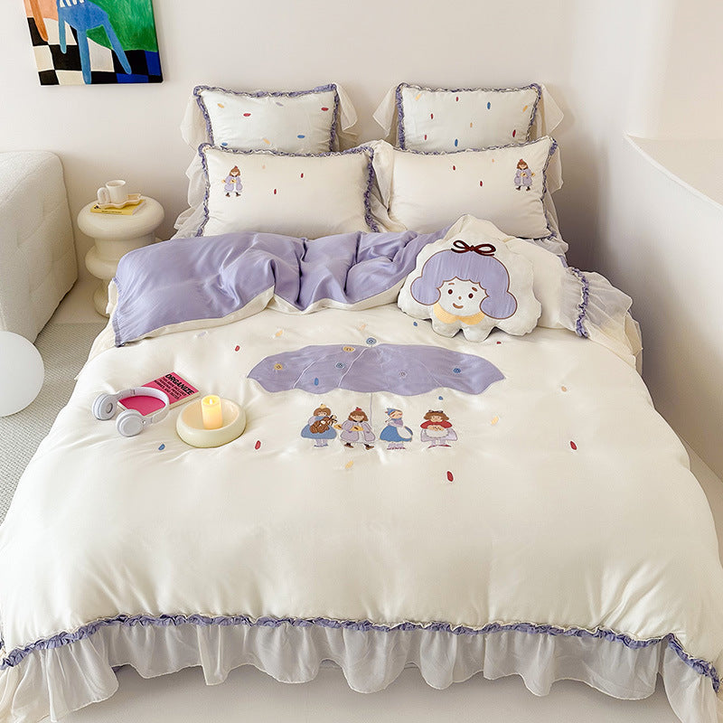 Children's bedding set with embroidered doll appliqués, ruffle and cuddle pillow