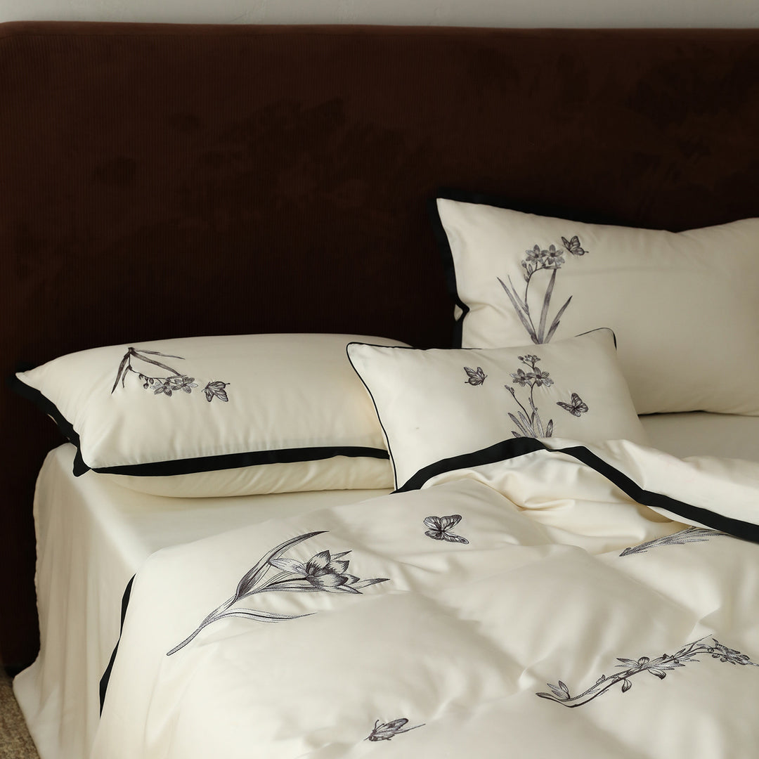 High-quality bedding set made of cotton satin with fine embroidery and black piping