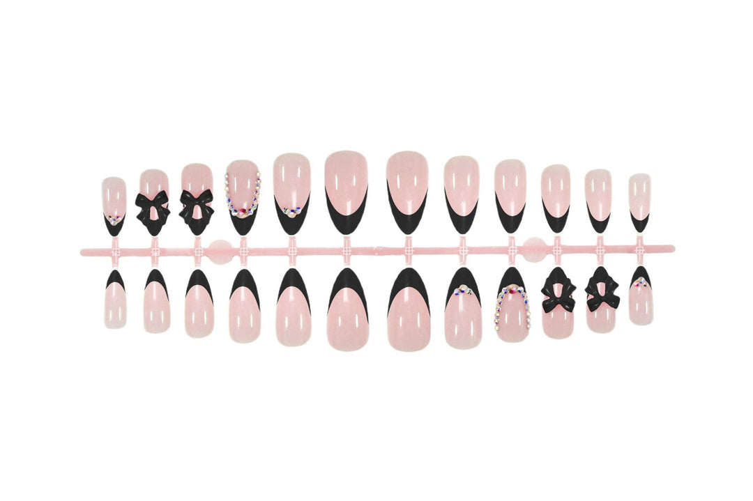 Artificial nail set with glamorous bow design and sparkling accents Kalsten