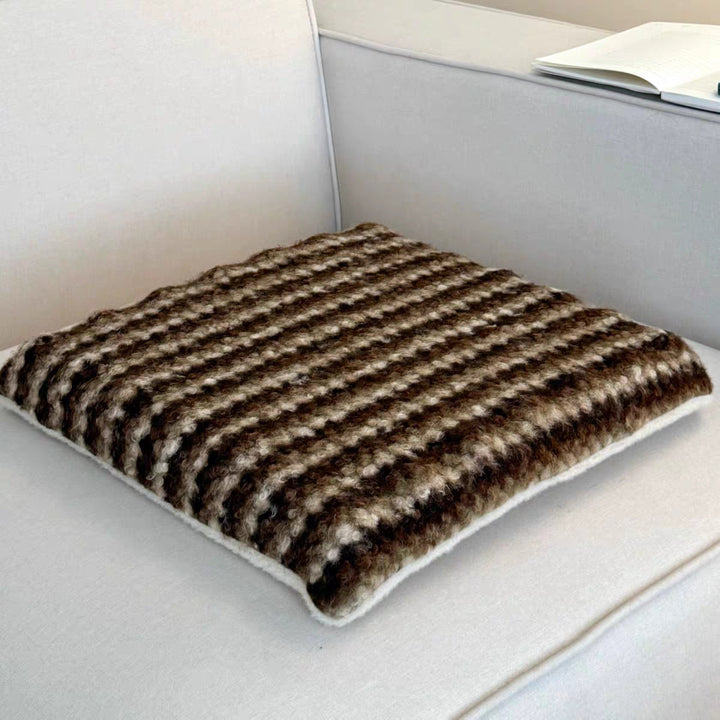 Knitted decorative cushion with wool blend and retro stripe texture