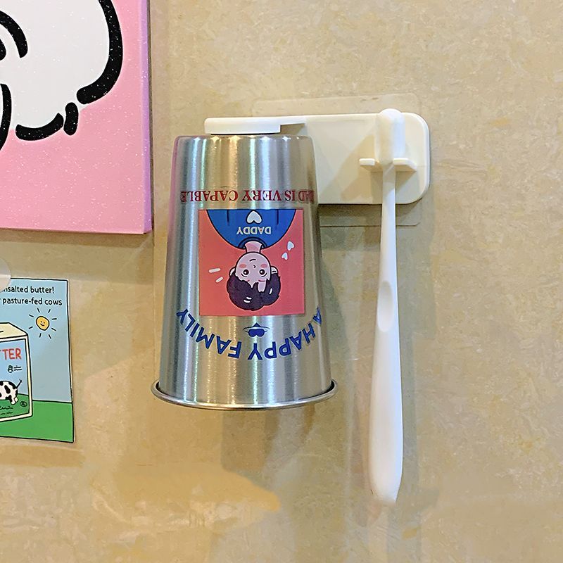 Wall-mounted cup with playful design Kalsten