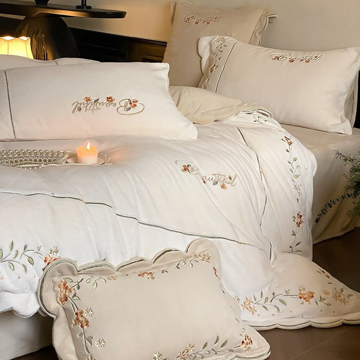 High-quality embroidered bedding set made of cotton percale with ruffled hem and floral relief