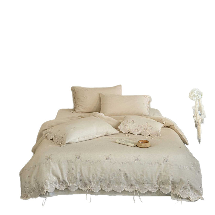 Luxurious embroidered linen bedding set with lace edge