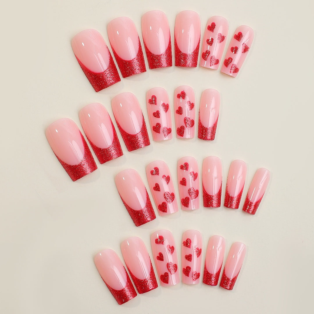Acrylic nail set with glamorous heart designs and glitter accents Kalsten