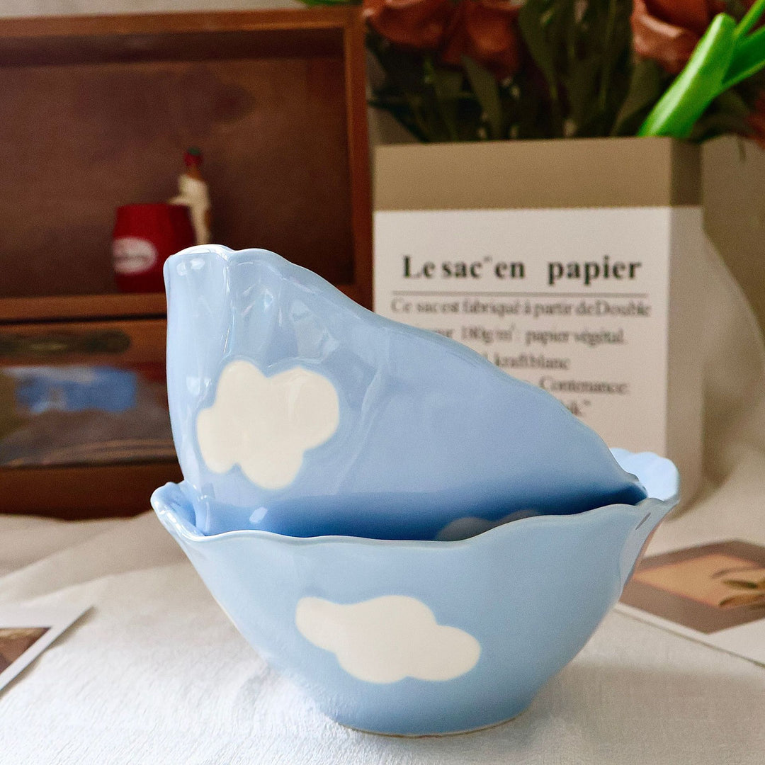 Decorative hand-painted ceramic bowl with wavy edge and tulip design