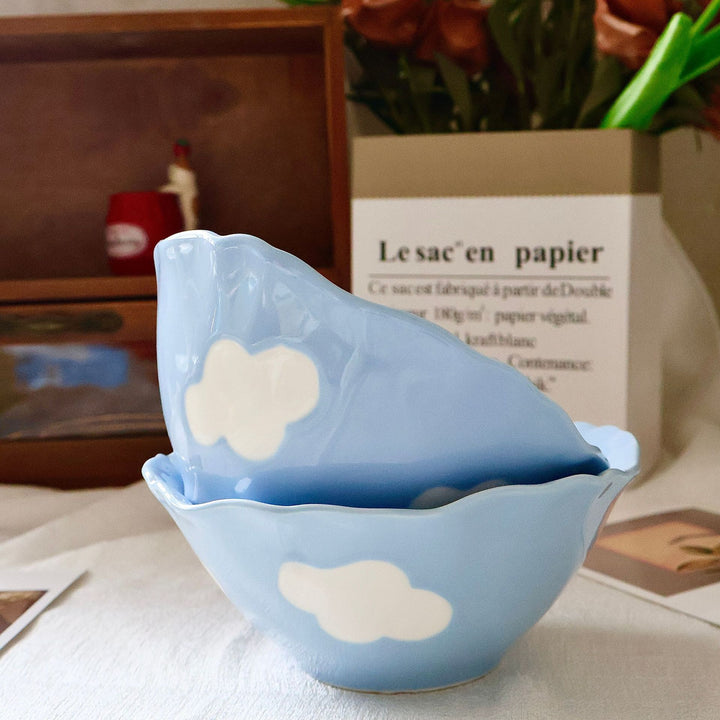 Decorative hand-painted ceramic bowl with wavy edge and tulip design